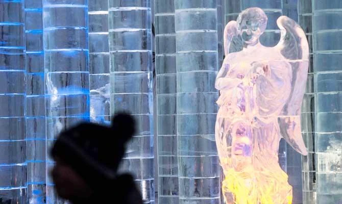 A tourist visits a Tatra Ice Temple at Hrebienok, High Tatras mountains resort in eastern Slovakia on February 27, 2019. (AFP)