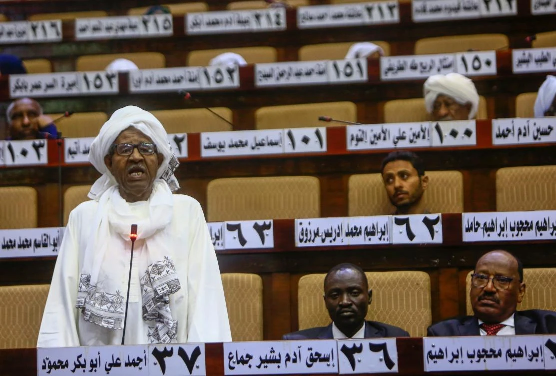 A Sudanese parliament member speaks during a National Assembly emergency session discussing a state of emergency declared by the president following anti-government protests, on March 11, 2019. (AFP)