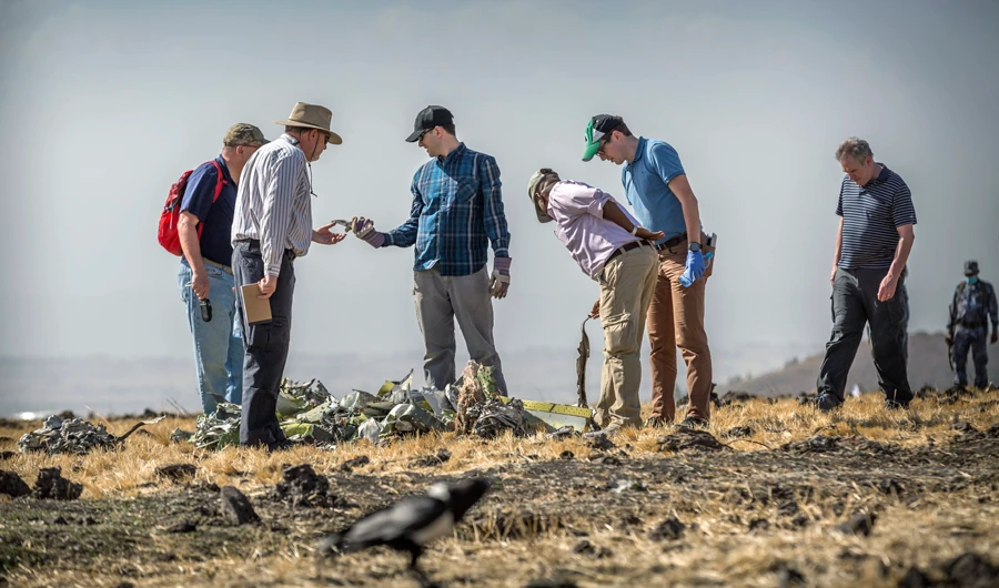 Foreign investigators examine wreckage at the scene where the Ethiopian Airlines Boeing 737 Max 8 crashed shortly after takeoff on Sunday killing all 157 on board, near Bishoftu, or Debre Zeit, south of Addis Ababa, in Ethiopia Tuesday, March 12, 2019. (AP)