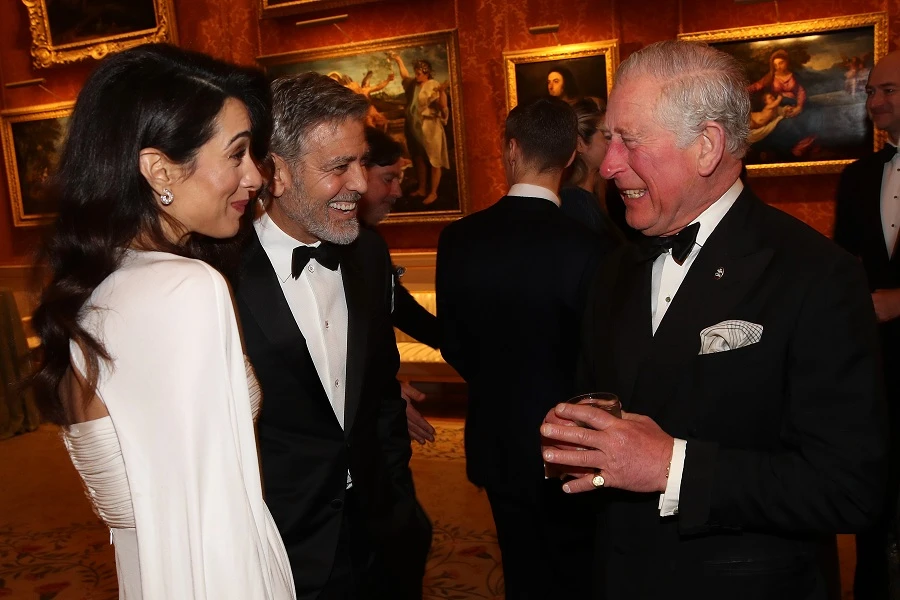 The power couple shared a joke with Prince Charles. (Getty Images)