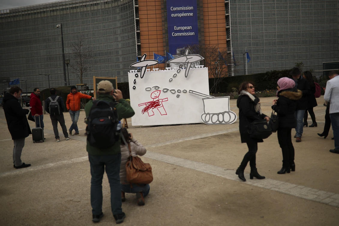 “Save the Children” NGO displayed a drawing by a Syrian child outside the European Commission and Council headquarters ahead of the conference. (AP)