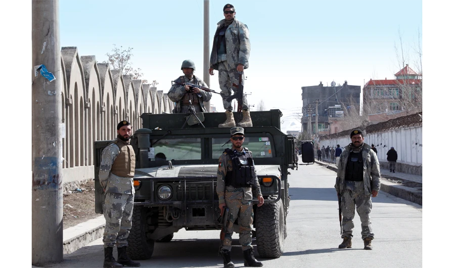 Afghan security forces keep watch at the site of an attack in Kabul on March 7. (Reuters)