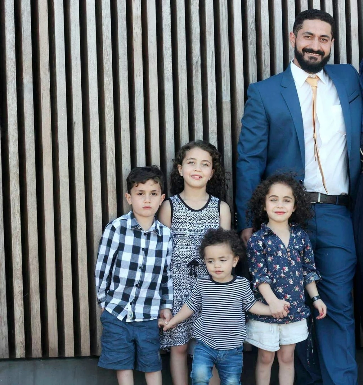 Jordanian barber Wasseim Alsati and his family. (Facebook)