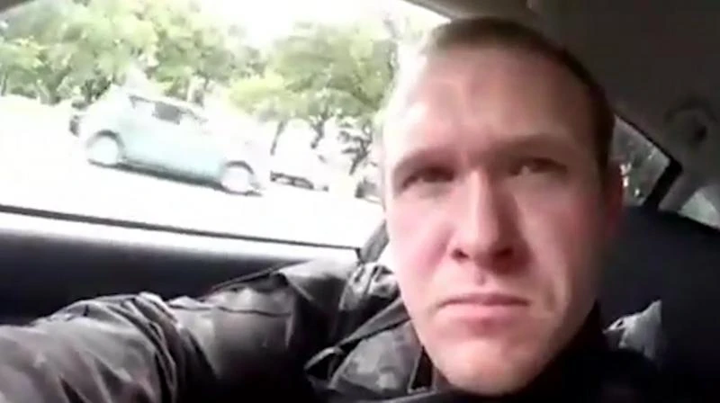 This image taken from the alleged shooter's video, which was filmed Friday, March 15, 2019, shows him as he drives and he looks over to three guns on the passenger side of his vehicle in New Zealand. (AP)