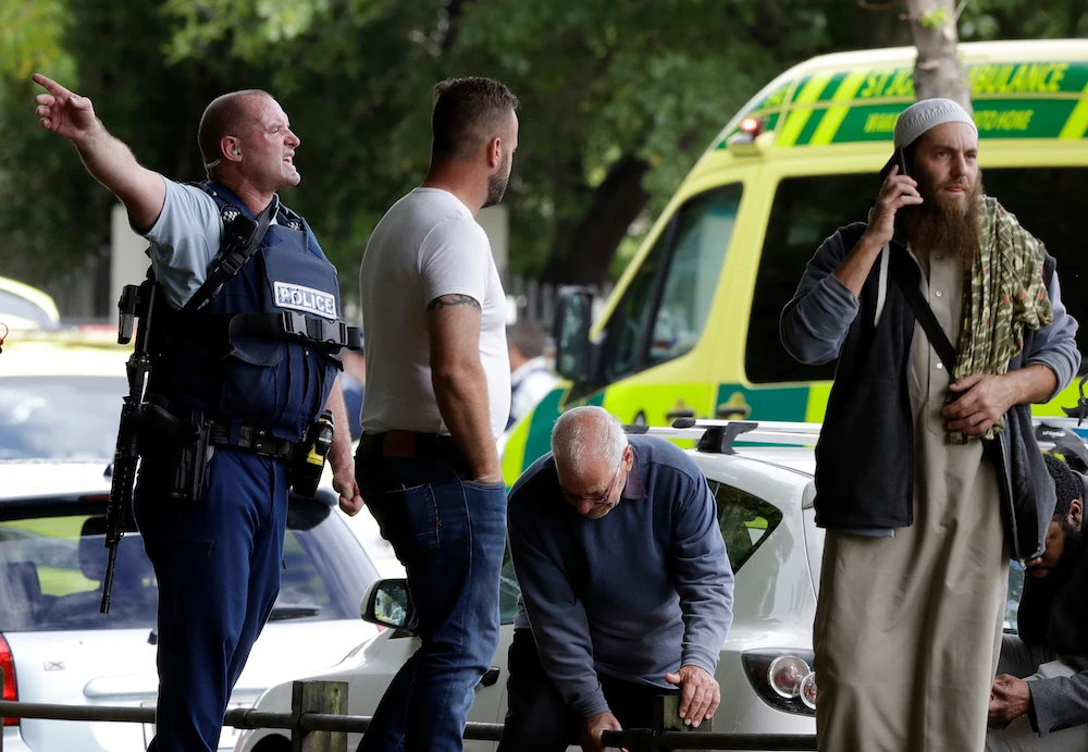 Police attempt to clear people from outside the mosque in central Christchurch, New Zealand after the attack. (AP)