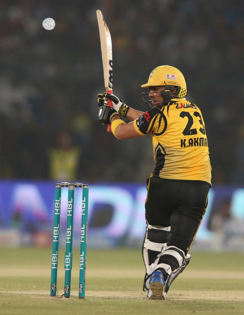 Kamran Akmal of Peshawar Zalmi hits a boundary against Islamabad United during the Pakistan Super League playoff at National Stadium in Karachi on Friday. (AP Photo)