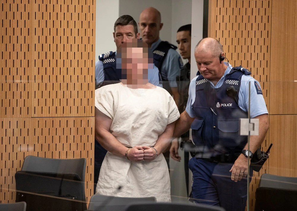 Brenton Tarrant, charged for murder in relation to the mosque attacks, is led into the dock for his appearance in the Christchurch District Court, New Zealand March 16, 2019. (Reuters)