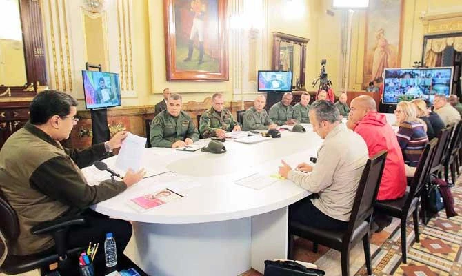 Handout photo released by the Venezuelan Presidency's press office showing Venezuela's President Nicolas Maduro (L) during a meeting with military commanders in the framework of the planning of "Civic Military Exercises" to take place in the weekend, at Miraflores Presidential palace in Caracas, on March 15, 2019. (AFP)