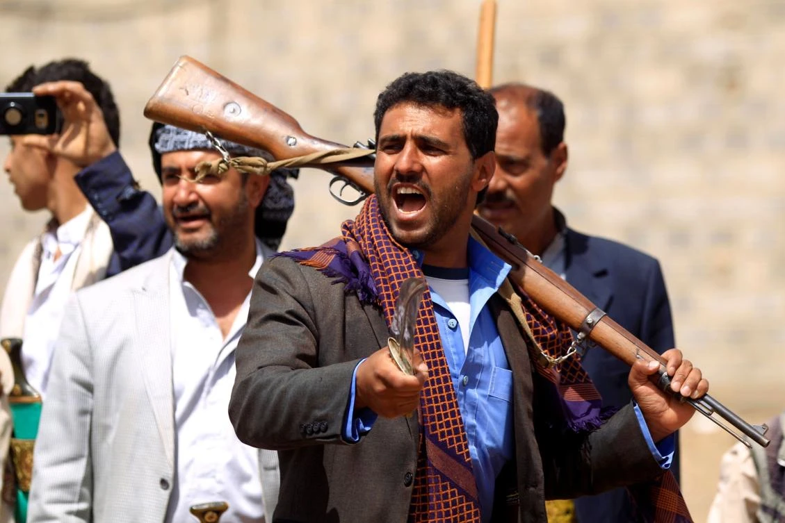 A man brandishes a knife as tribal gunmen loyal to the Houthi militia protest in Sanaa on Saturday. (AFP)