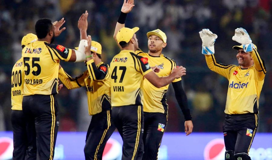 Players of Peshawar Zalmi celebrate their victory against Islamabad United, during the Pakistan Super League playoff at National Stadium in Karachi, Pakistan, on March 15, 2019. (AP)