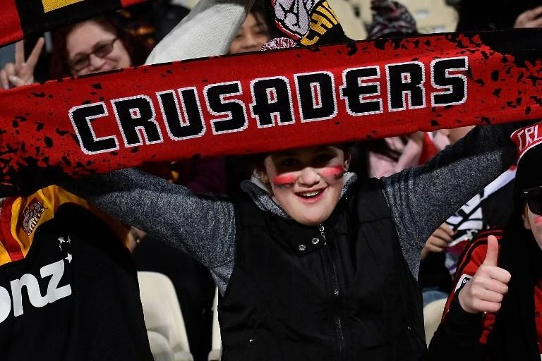 A fan cheers for the Canterbury Crusaders, the world’s most successful rugby franchise. (AFP)