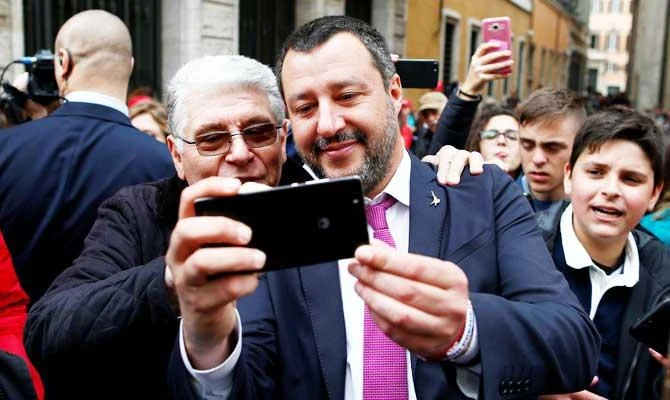 Italian Deputy Prime Minister and League leader Matteo Salvini takes a picture with a supporter, as he leaves the Senate upper house parliament building after a news conference in Rome, Italy March 8, 2019. (REUTERS)