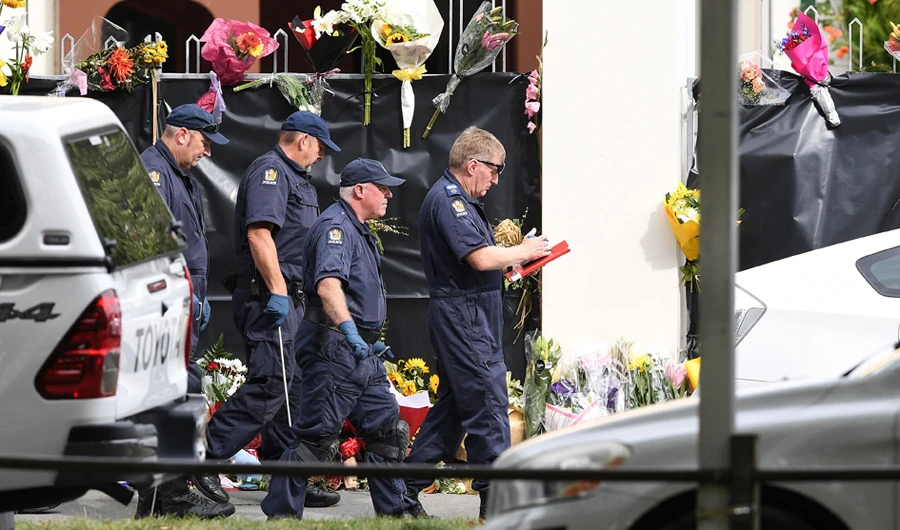 Police collect evidence at the Al Noor mosque on March 19, 2019 in Christchurch, New Zealand, where worshippers were gunned down four days ago. (AFP / William West)