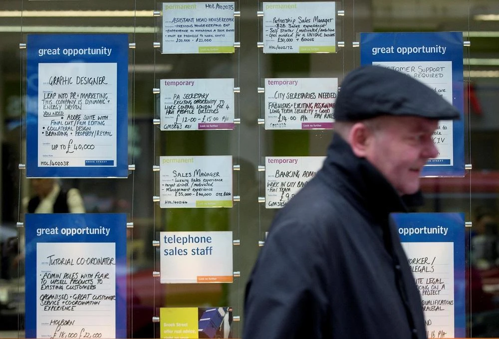The number of people in work surged by 222,000, helping to push down the unemployment rate to 3.9 percent. (Reuters)