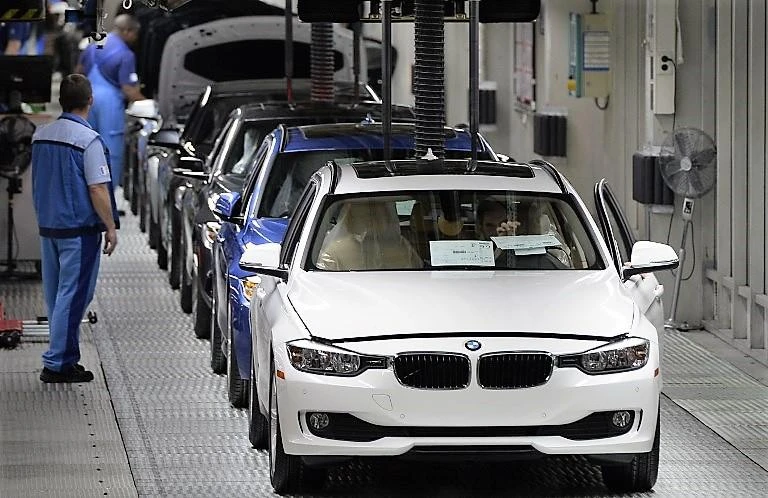 BMW’s total number of employees is set to remain flat at around 135,000 worldwide, and new recruits would be IT specialists. (AFP)