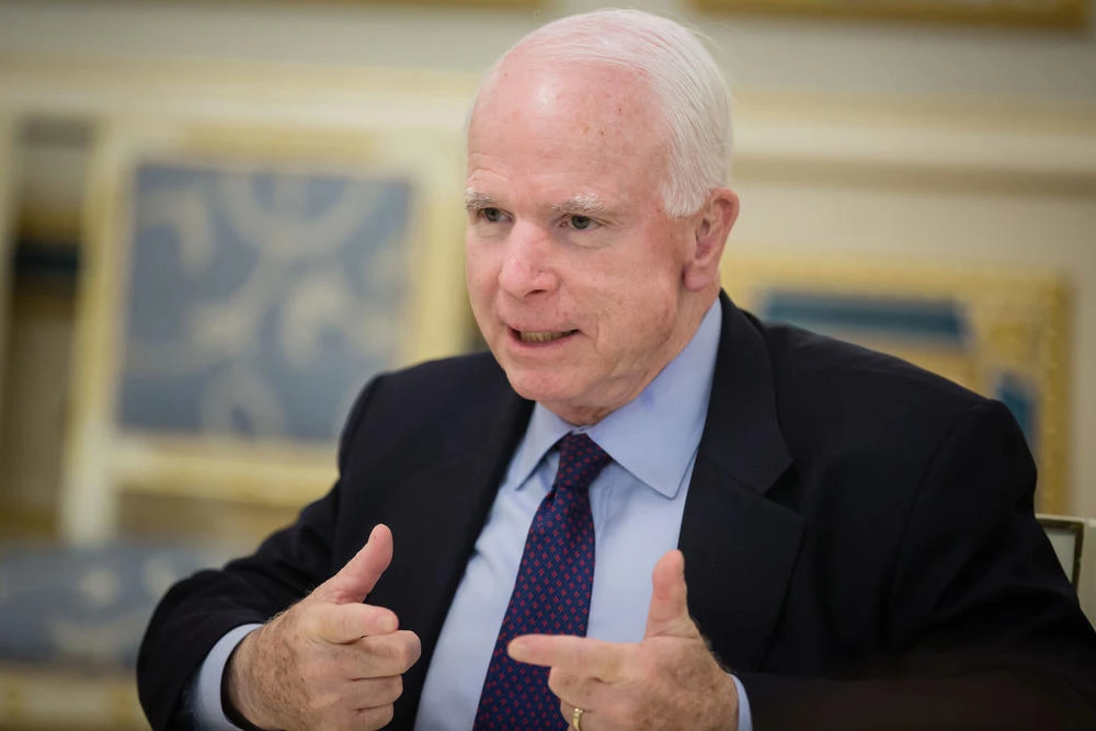 Trump aims new blasts at McCain, claims credit for funeral
