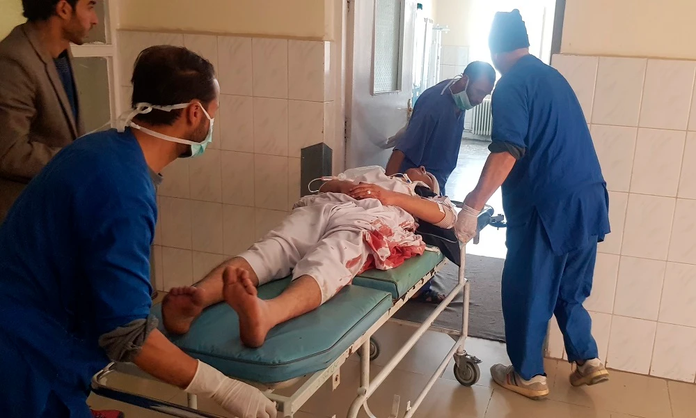 Hospital staff members carry a wounded victim on stretcher to emergency ward in Kabul, Thursday, March 21, 2019. (Reuters)