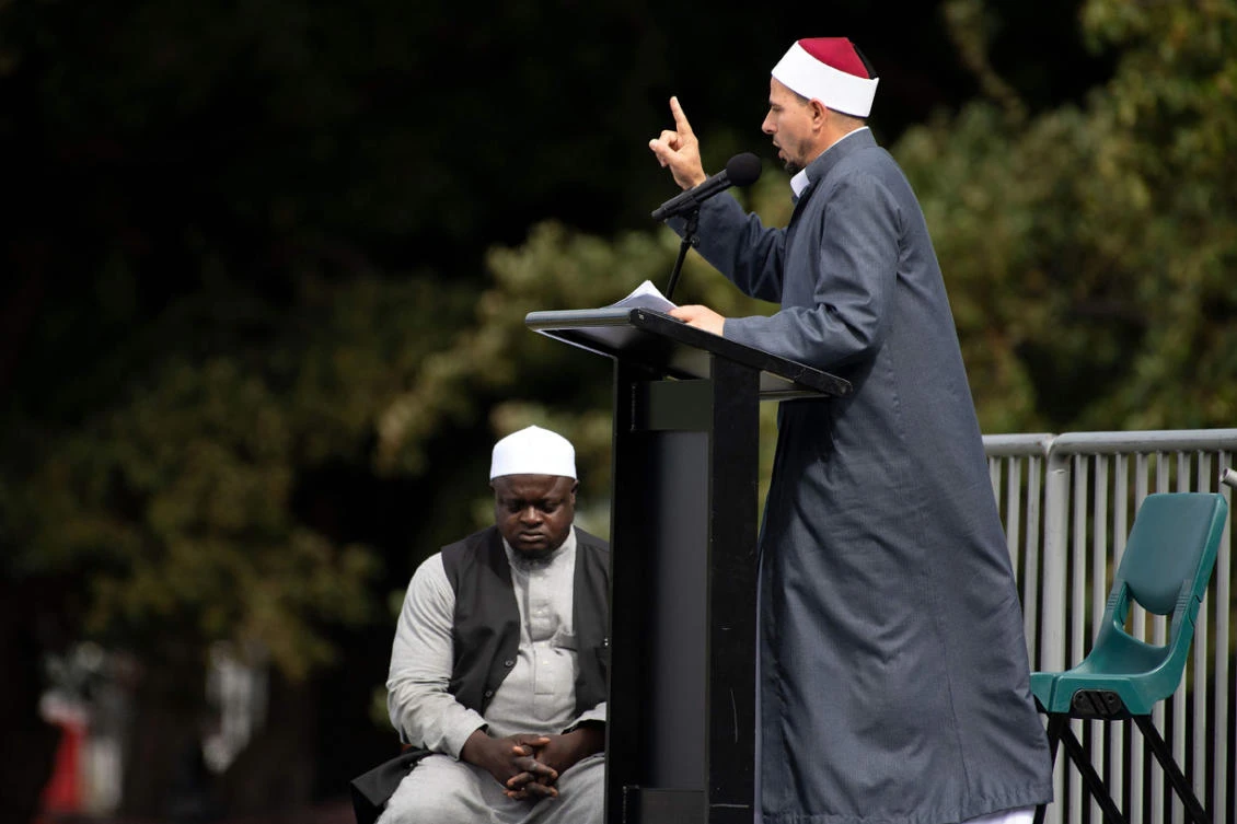 Gamal Fouda, the imam of tragedy-stricken Al Noor mosque, delivers a sermon ahead of a two-minute observation of silence for victims of the twin mosque massacre, during congregational Friday prayers and memorial gathering at Hagley Park in Christchurch on March 22, 2019. (AFP)