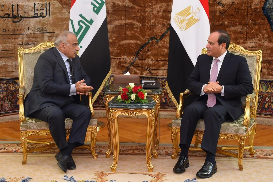 A handout picture released by the Egyptian Presidency on March 23, 2019 shows Egyptian President Abdel Fattah El-Sisi (R) receiving Iraqi Prime Minister Adel Abdel Mahdi at the presidential palace in the capital Cairo. (AFP PHOTO/ HO/ Egyptian Presidency)