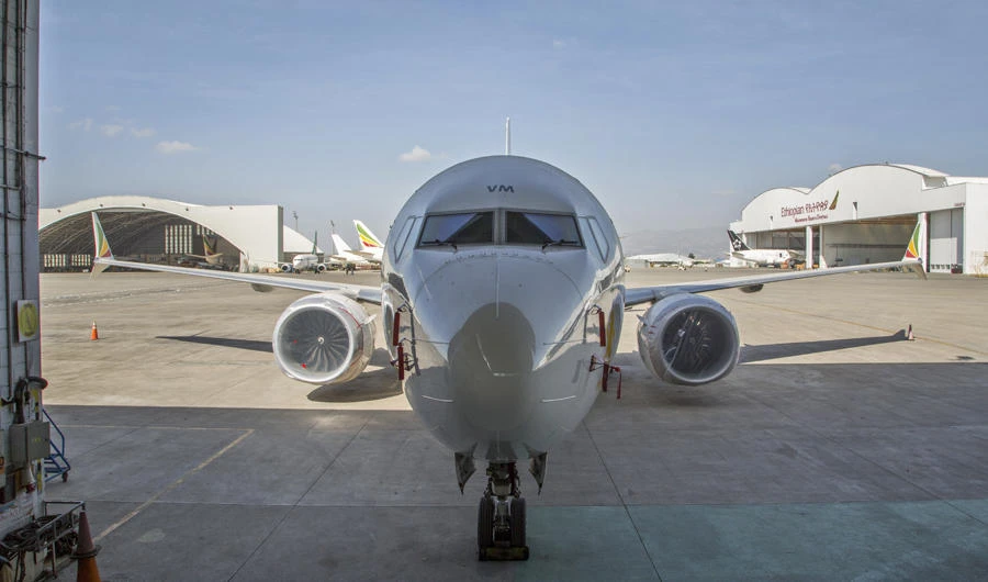 An Ethiopian Airlines Boeing 737 Max 8 sits grounded near a hangar at Bole International Airport in Addis Ababa, Ethiopia, on March 23, 2019. (AP Photo/Mulugeta Ayene)