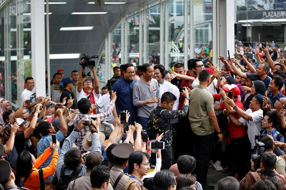 Indonesia’s President Joko Widodo joins a crowd during the launch of the Jakarta Mass Rapid Transit on Sunday, March 24, 2019. (Reuters)
