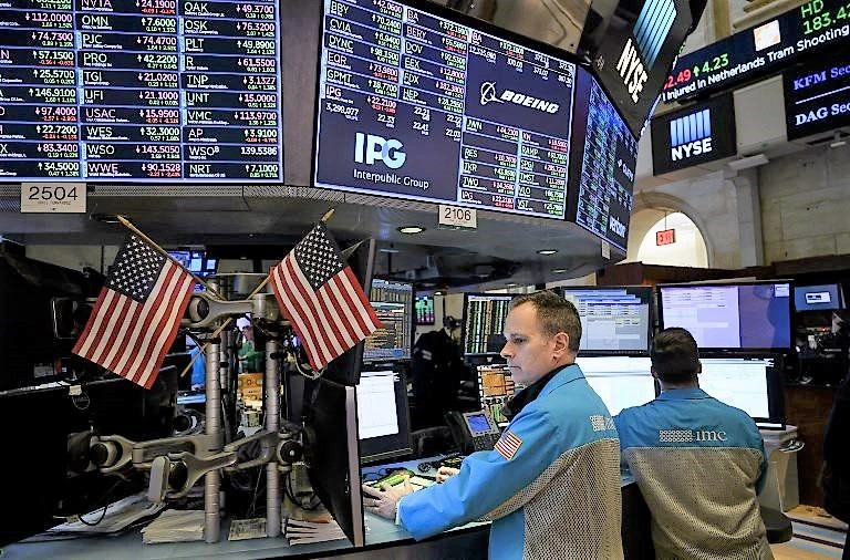 Three-quarters of the survey respondents cut their US GDP forecasts and believe the risks of to the economy are weighted to the downside. (AFP)