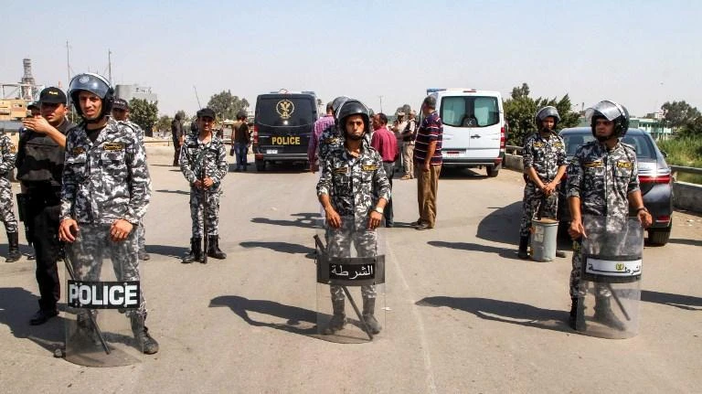 Egyptian military forces stand around body of suicide bomber next to Coptic Orthodox Church of the Virgin Mary. (AFP/File)