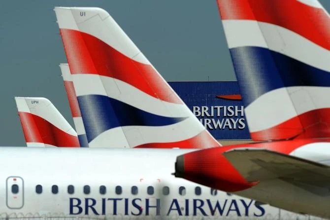 This file picture taken on May 24, 2010 shows the British Airways logo between tailfins of aircraft parked at Heathrow Airport, west of London. (AFP)