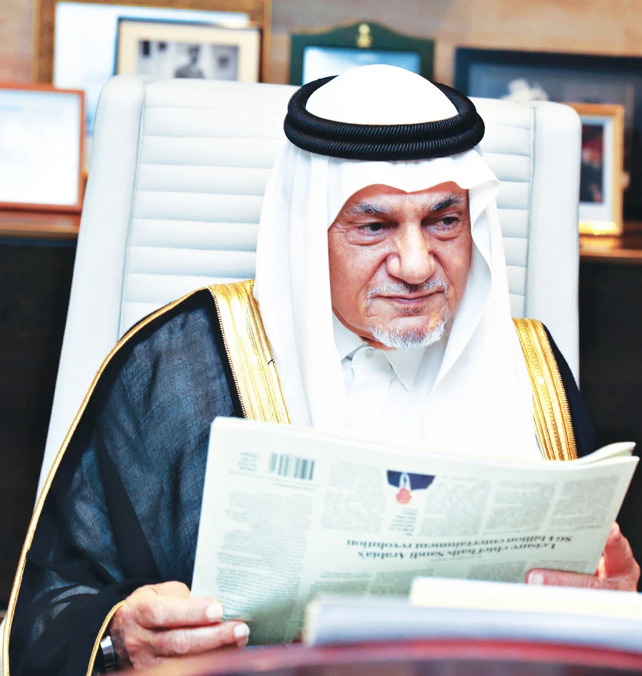 Saudi Arabia’s former diplomat Prince Turki Al-Faisal reading Arab News. (AN photo by Basheer Saleh)