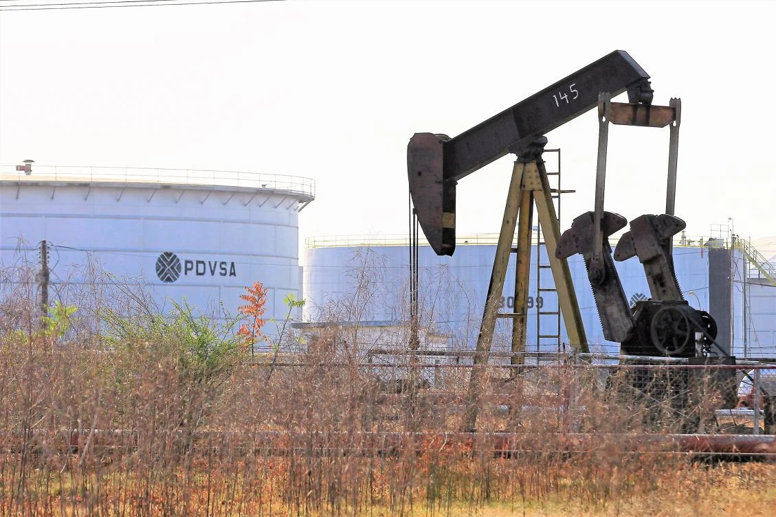 Above, an oil pumpjack and a tank at a facility of state owned Petróleos de Venezuela, SA in Lagunillas, Venezuela. (Reuters)