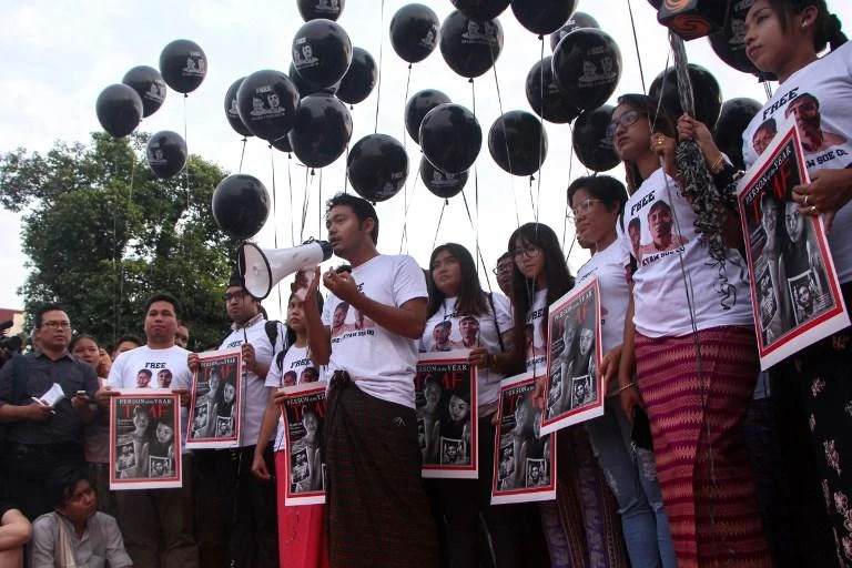 Supporters of Reuters journalists Wa Lone and Kyaw Soe Oo hold a rally in Yangon on December 12, 2018 to demand their freedom. (AFP)