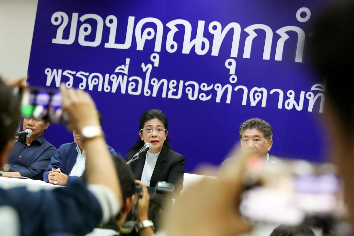 Pheu Thai’s prime ministerial candidate Sudarat Keyuraphan, center, said an opposition alliance would form a majority in the lower house of parliament and the right to try to form a government. (Reuters)