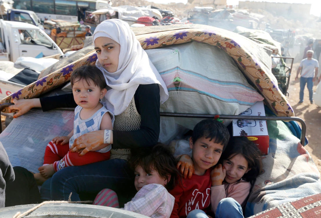 Syrian refugees prepare to return to Syria from the Lebanese border town of Arsal. Lebanon says it is hosting 1.5 million Syrians. (Reuters file photo)