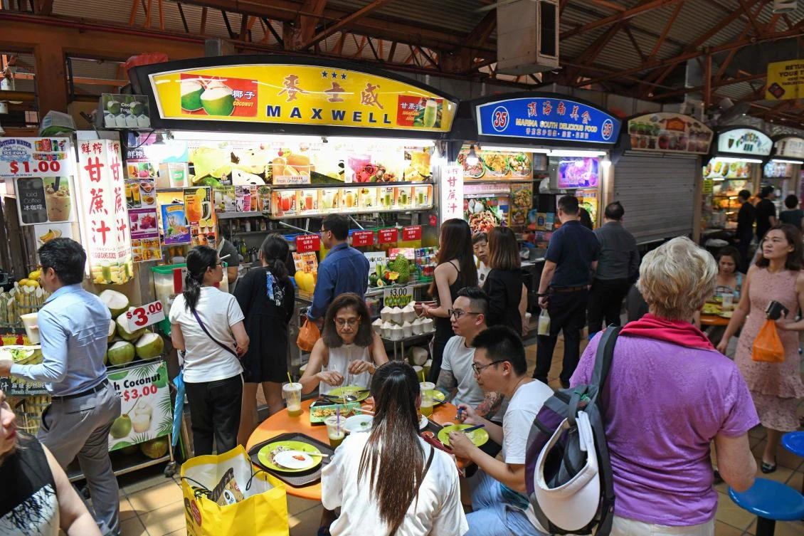 The city-state is home to many open-air food courts where vendors, known as ‘hawkers,’ serve dishes at relatively cheap prices. (AFP)