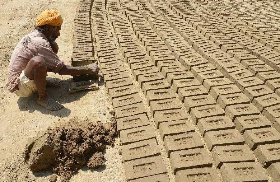 An Indian labour works in a brick kiln on the outskirts of Amritsar. (File/AFP)