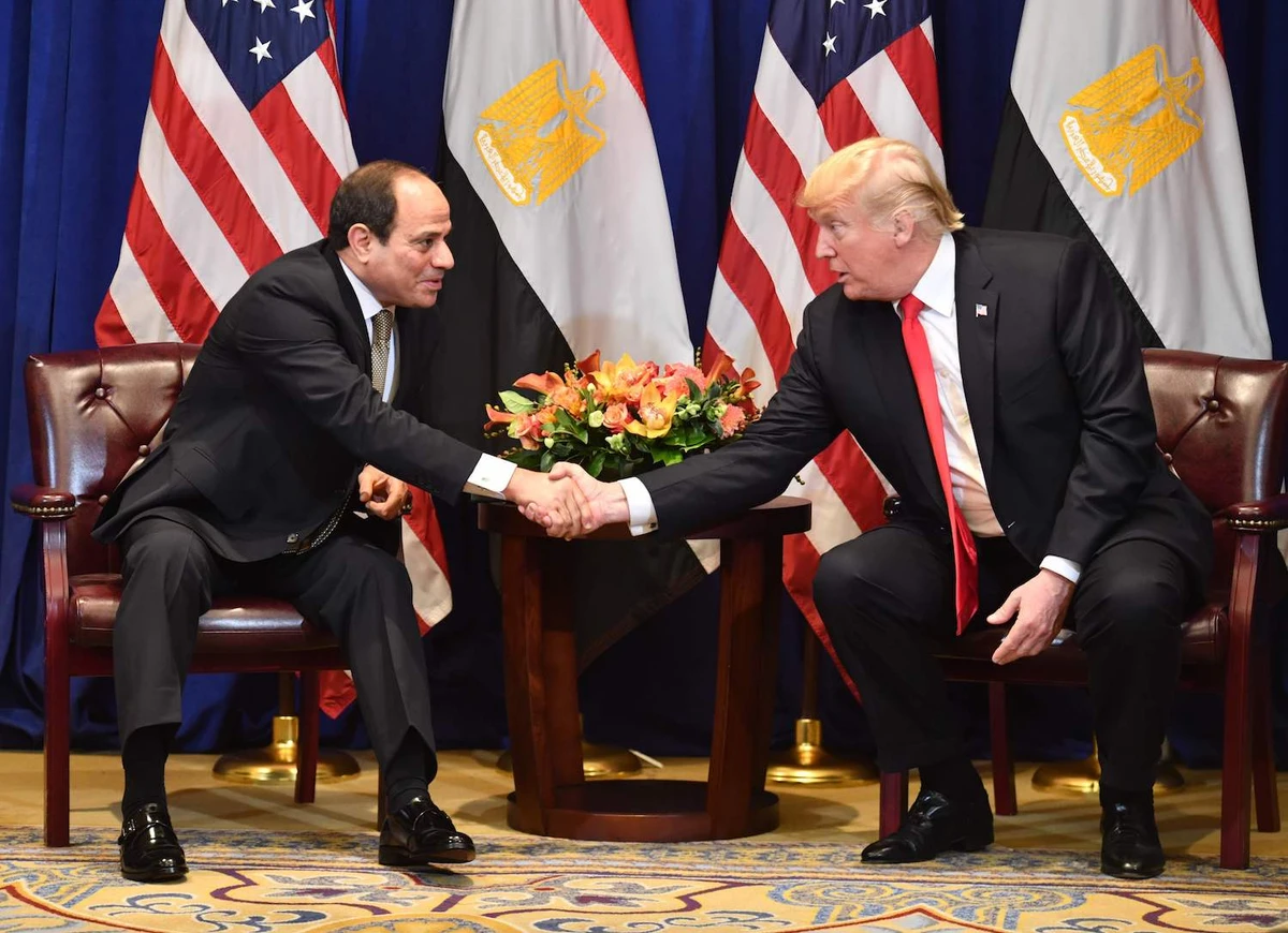 In this file photo taken on September 24, 2018, Egyptian President Abdel Fattah al-Sisi (L), shakes hands with US President Donald Trump (R) at the start of a bilateral meeting in New York. (AFP)