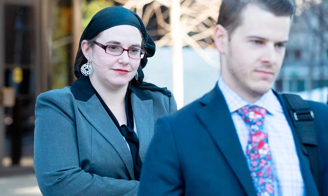 Estranged wife of ex Afghan hostage says he beat her
