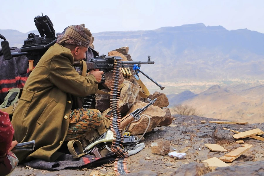 A brigade from Yemen's army clashed with Houthi militia near a mountain.