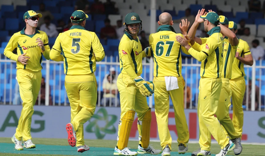 Australia team players celebrate the dismissal of during the first one-day international (ODI) cricket match between Pakistan and Australia in Sharjah on March 22, 2019. (AFP)