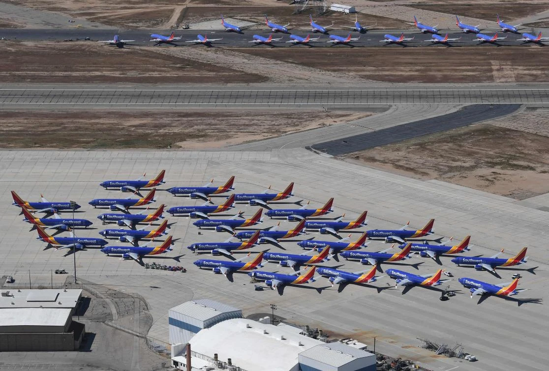 Southwest Airlines Boeing 737 MAX aircraft (foreground) are parked on the tarmac after being grounded, at the Southern California Logistics Airport in Victorville, California on March 28, 2019. (AFP)