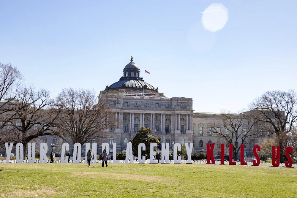 People take photos of the March For Our Lives students place gun violence prevention art on the US Capitol grounds on March 26, 2019 in Washington, DC. (Tasos Katopodis/Getty Images/AFP)