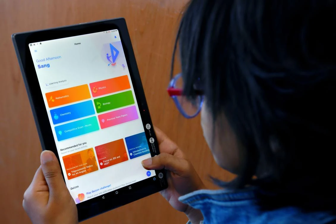 An Indian student navigates through the education technology start-up Byju’s mobile application. (AFP)