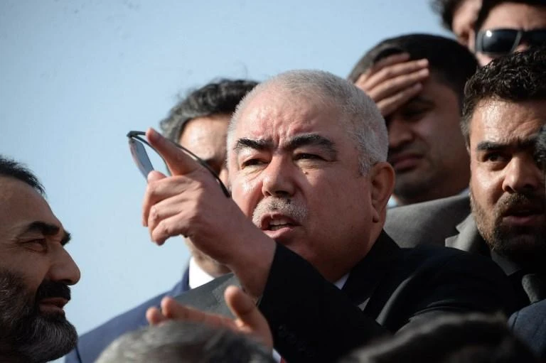 Gen. Abdul Rashid Dostum, center, escaped unharmed after Taliban ambushed his convoy. (AFP)