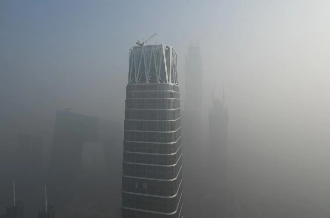 In this file photo taken on January 1, 2017, buildings are seen on a polluted day in Beijing. (AFP)