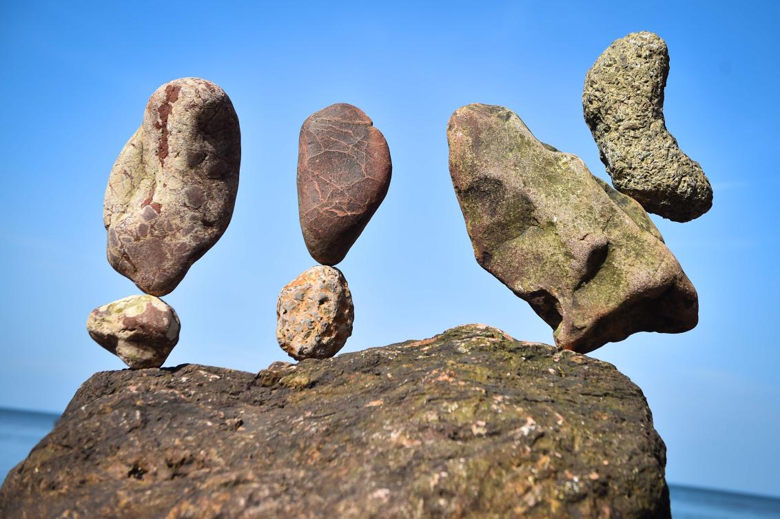A picture shows a balanced sculpture built during the European Stone Stacking Championships 2019 in Dunbar, Scotland, on April 21, 2019. The European Stone Stacking Championships are Europe’s largest championships for all Stone Stacking and Rock Balancing artists and practitioners. Stackers compete in four competitions creating sculptures using stones and balancing them using only the force of gravity. The overall winner receives a trip to llano Earth Art Festival and World Stone Balancing competition 2020. / AFP / Andy Buchanan