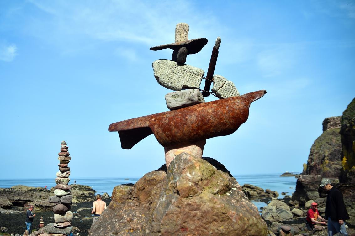 A picture shows a balanced sculpture built during the European Stone Stacking Championships 2019 in Dunbar, Scotland, on April 21, 2019. The European Stone Stacking Championships are Europe’s largest championships for all Stone Stacking and Rock Balancing artists and practitioners. Stackers compete in four competitions creating sculptures using stones and balancing them using only the force of gravity. The overall winner receives a trip to llano Earth Art Festival and World Stone Balancing competition 2020. / AFP / Andy Buchanan