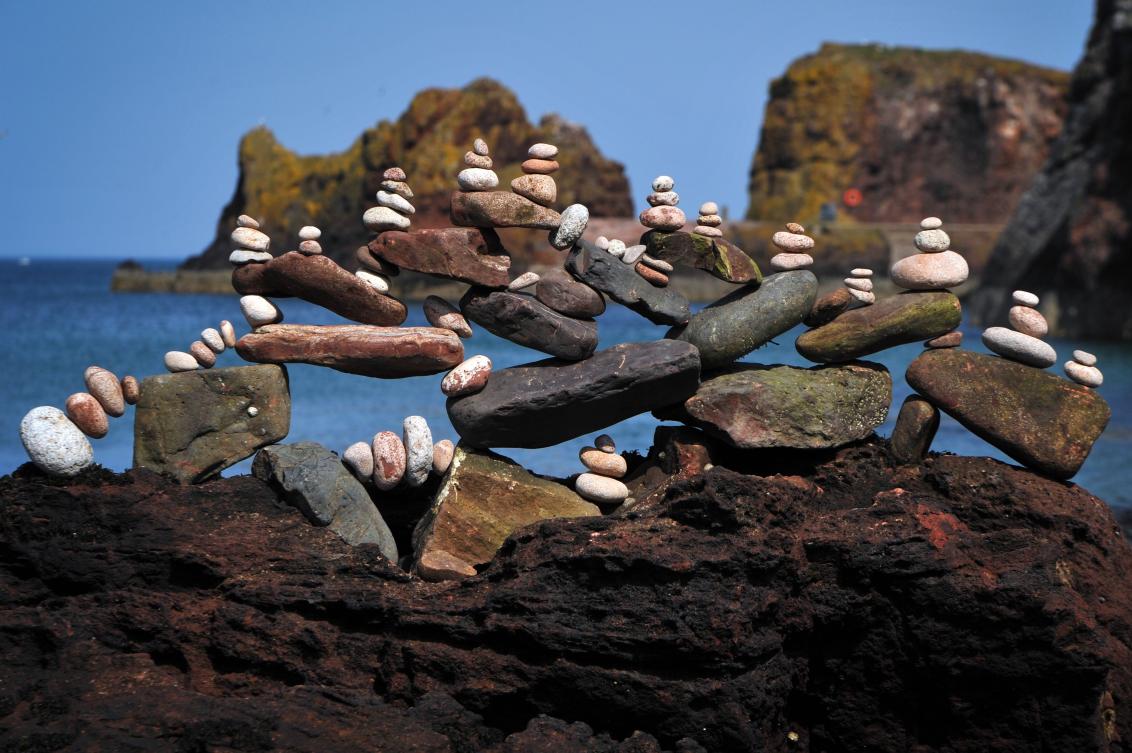 A picture shows a balanced sculpture built during the European Stone Stacking Championships 2019 in Dunbar, Scotland, on April 21, 2019. The European Stone Stacking Championships are Europe’s largest championships for all Stone Stacking and Rock Balancing artists and practitioners. Stackers compete in four competitions creating sculptures using stones and balancing them using only the force of gravity. The overall winner receives a trip to llano Earth Art Festival and World Stone Balancing competition 2020. / AFP / Andy Buchanan