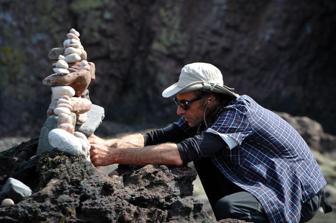 Pedro Duran from Spain competes in the European Stone Stacking Championships 2019 in Dunbar, Scotland, on April 21, 2019. The European Stone Stacking Championships are Europe’s largest championships for all Stone Stacking and Rock Balancing artists and practitioners. Stackers compete in four competitions creating sculptures using stones and balancing them using only the force of gravity. The overall winner receives a trip to llano Earth Art Festival and World Stone Balancing competition 2020. / AFP / Andy Buchanan