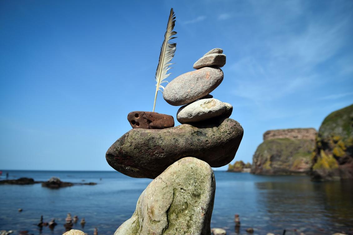 A picture shows a balanced sculpture built during the European Stone Stacking Championships 2019 in Dunbar, Scotland, on April 21, 2019. The European Stone Stacking Championships are Europe’s largest championships for all Stone Stacking and Rock Balancing artists and practitioners. Stackers compete in four competitions creating sculptures using stones and balancing them using only the force of gravity. The overall winner receives a trip to llano Earth Art Festival and World Stone Balancing competition 2020. / AFP / Andy Buchanan