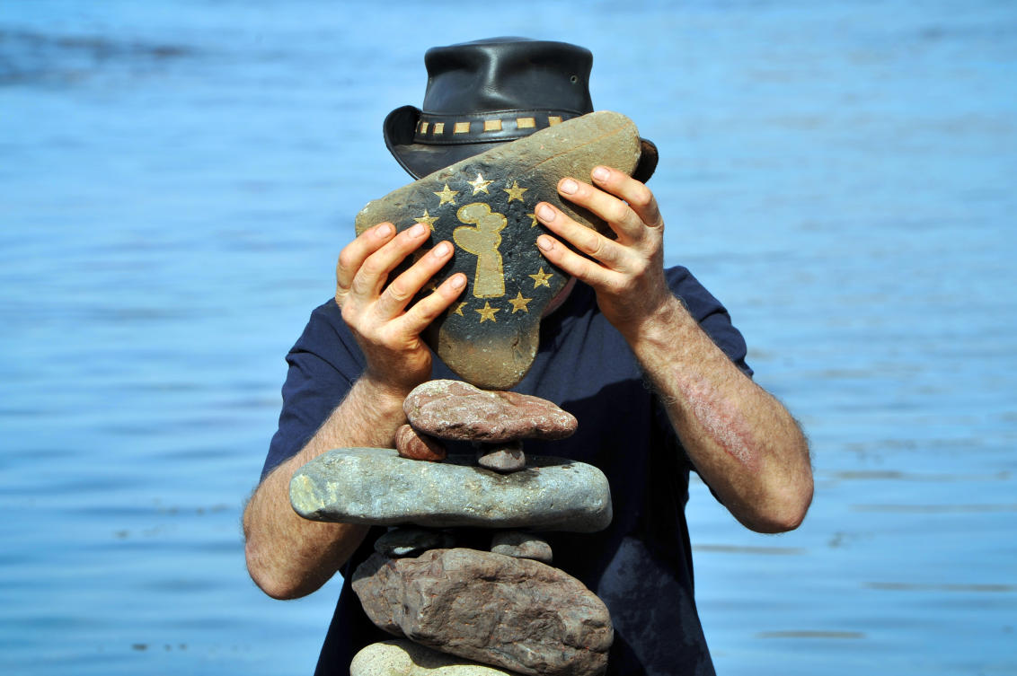 Harry Maddox from Cornwall competes in the European Stone Stacking Championships 2019 in Dunbar, Scotland, on April 21, 2019. The European Stone Stacking Championships are Europe’s largest championships for all Stone Stacking and Rock Balancing artists and practitioners. Stackers compete in four competitions creating sculptures using stones and balancing them using only the force of gravity. The overall winner receives a trip to llano Earth Art Festival and World Stone Balancing competition 2020. / AFP / Andy Buchanan